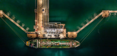 Aerial Top View Oil Tanker Ship At Terminal Industrial Port At N