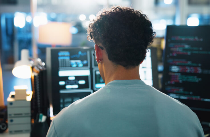 Office, Man And Programmer With Computer Screen For Coding, Backend Script And Engineer At Night. Back, Business Person And Developer With Digital For Software Development, System Update And Testing