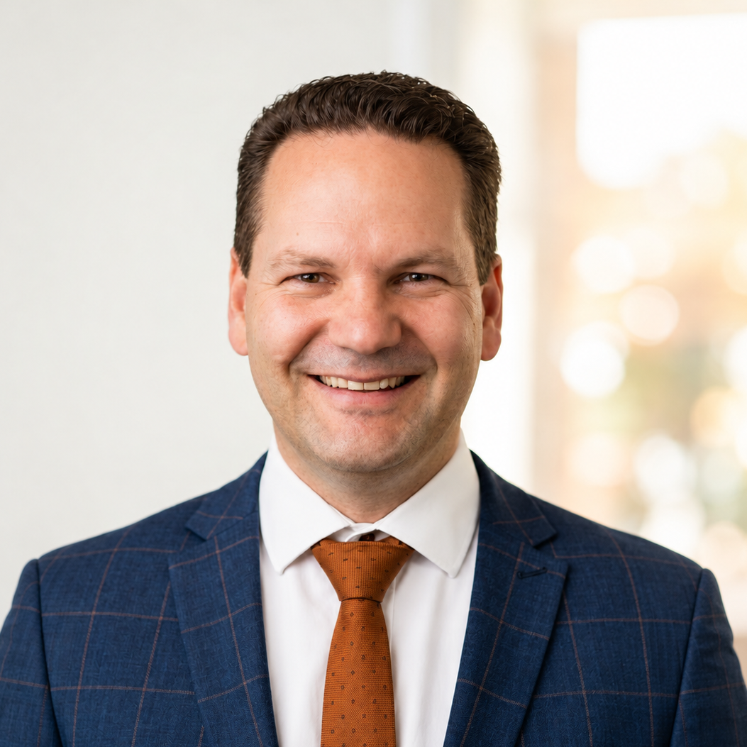 Corporate Headshot With Orange Tie